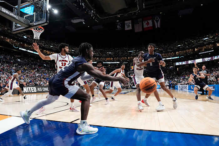 Fairleigh Dickinson Knights guard Demetre Roberts inbounds the ball.